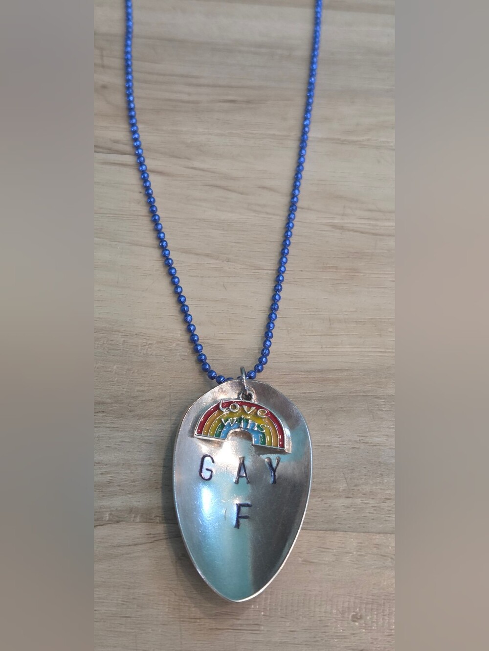 Blue Beaded Necklace with Rainbow 'Love Wins' Pendant
